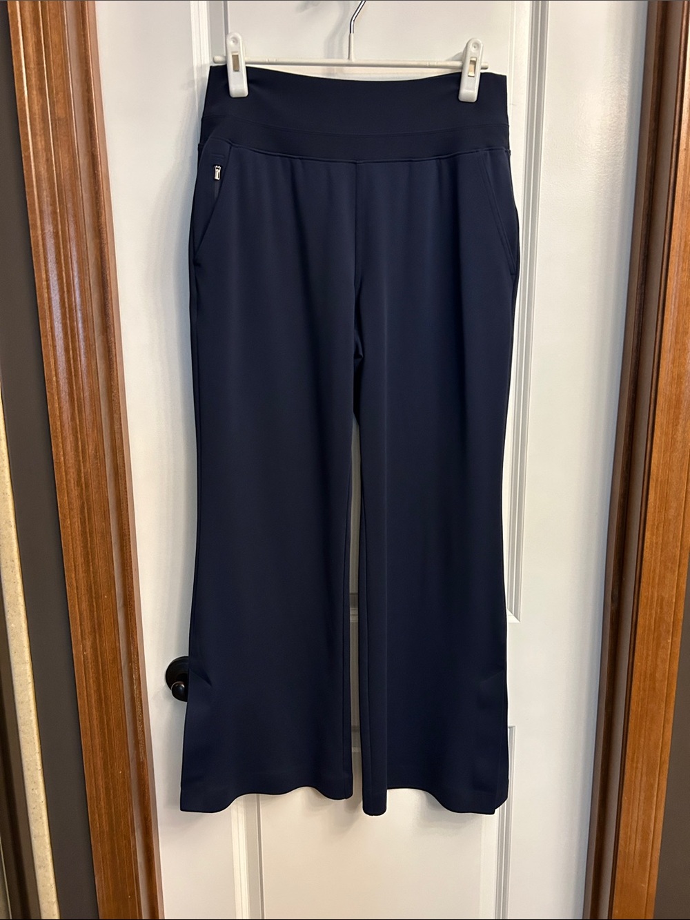 Athleta Venice Navy Fit and Flare High-Rise Pants with stylish kick pleat
